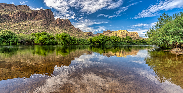 View of the salt river and canyon reflecting in the water