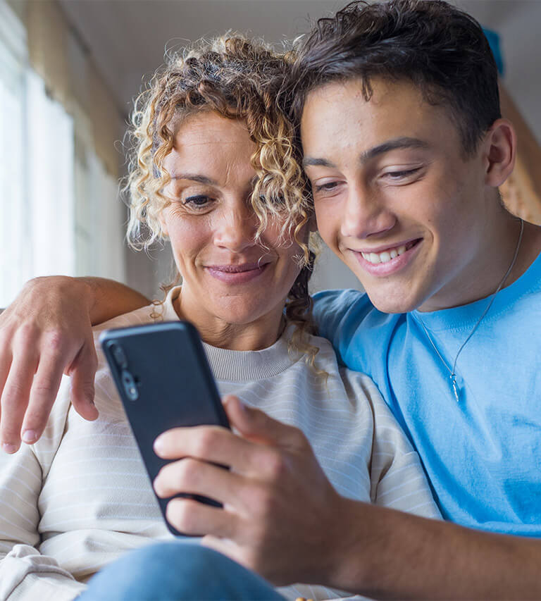 Scottsdale mother and son on a smartphone starting an urgent care telehealth appointment