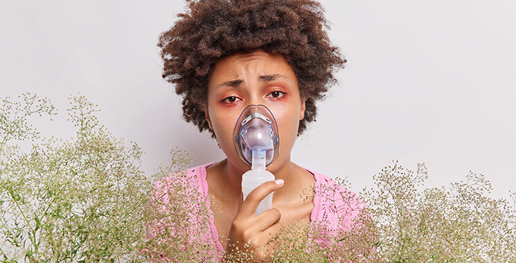 Woman with oxygen mask surrounded by flowers