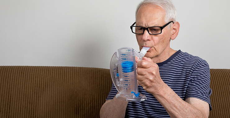 Man using spirometer